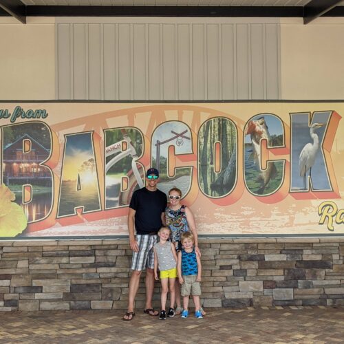 Ryan Foelske and his family beside the Babcock Ranch sign