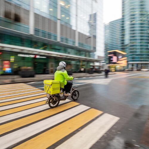 delivery man on a scooter in the city